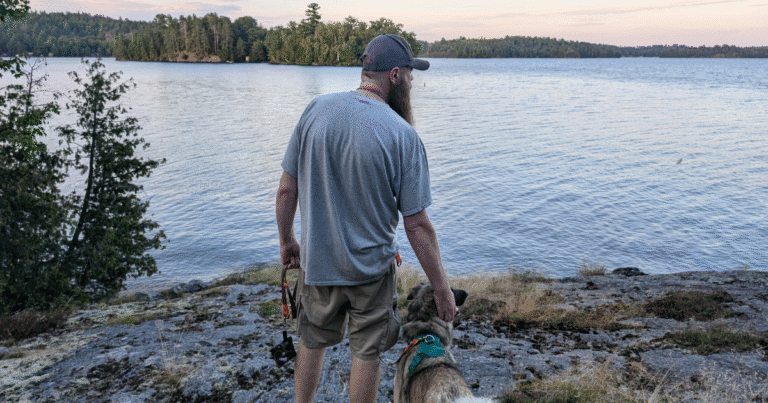 man and dog standing looking out at the lake | Fairbank Provincial Park: Video Review